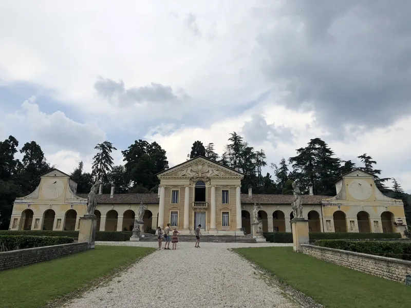 Palladian facade of Villa Barbaro at Maser with arcades and statues