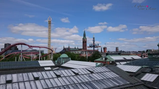 Copenhagen rooftops with church spires and the Tivoli roller coaster